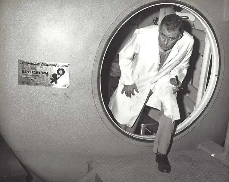 George Bond exiting a chamber