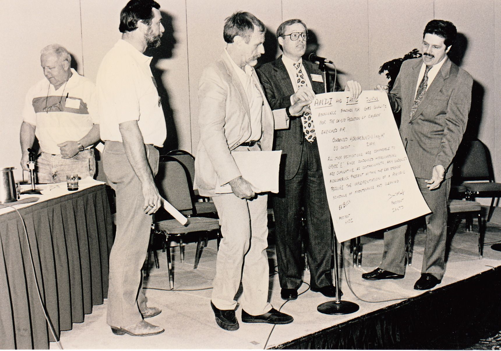 Steve Bielinda in background, foreground:  Frans Vandermolen, Tom Mount, Richard Nordstrom, and Ed Betts, presenting nitrox mixing standards