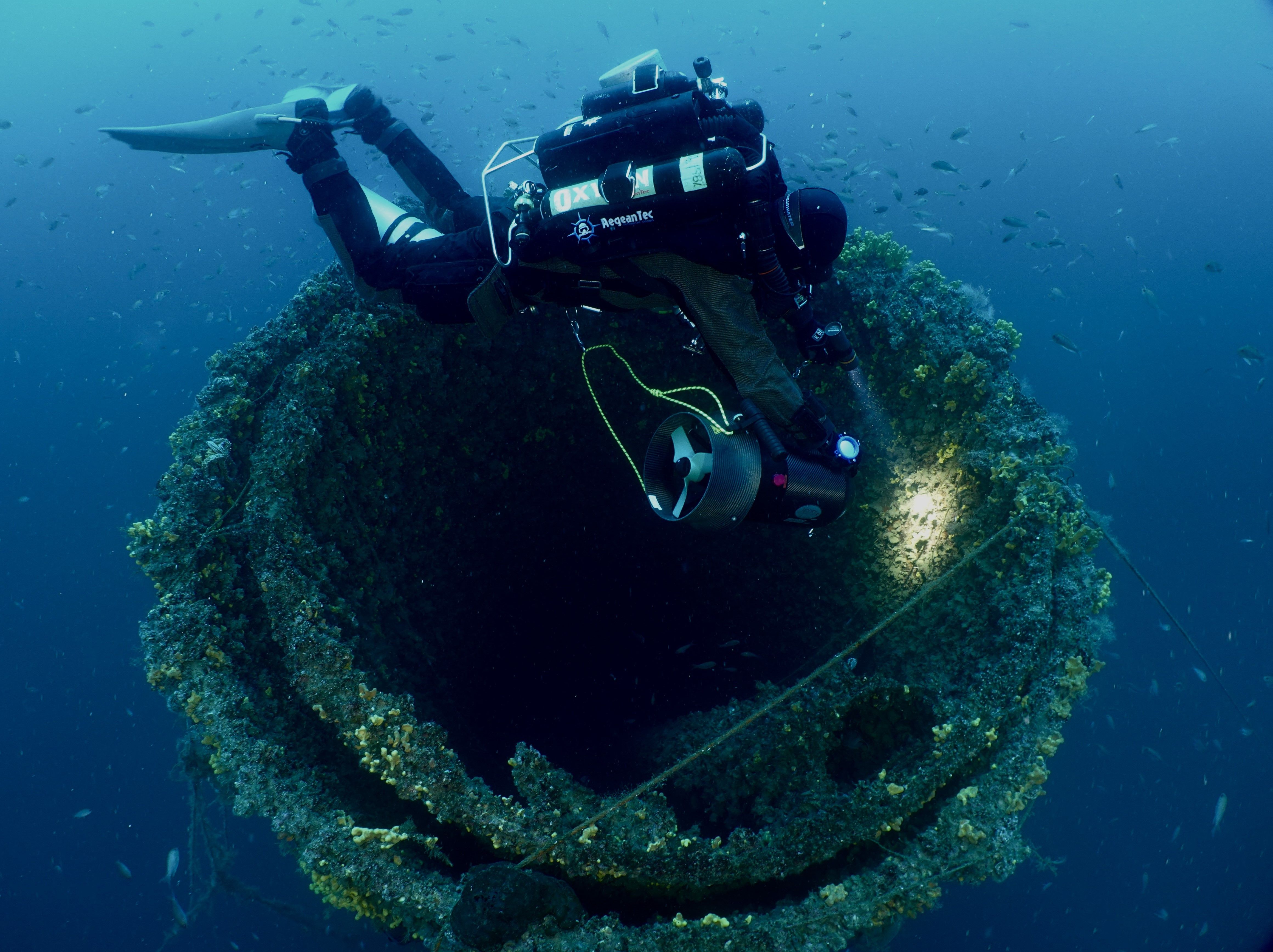 Diver examining the top section of the inmpressive funnel of HMS Ermine